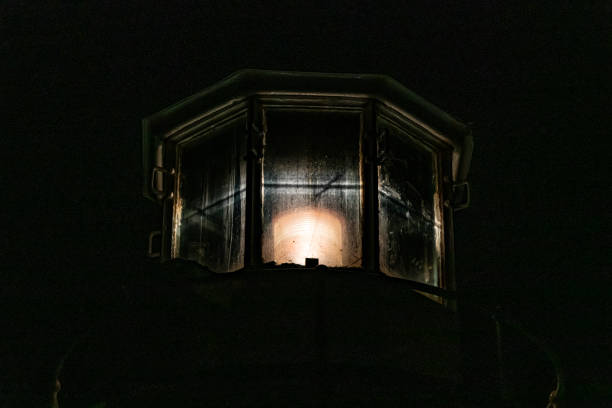 istock Close up front view of an illuminated lighthouse light 1194848092