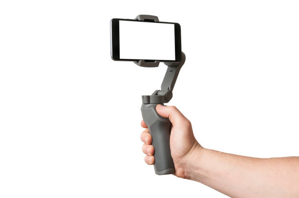 istock Man filming with a blank screen smartphone using a gimbal stabilizer, isolated on white background 1194848099