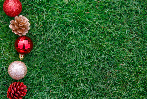 Close up christmas ornament above green grass textured background