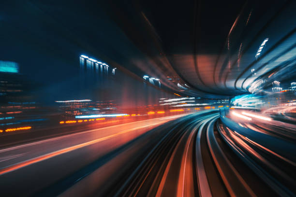 futuristic high speed light tail with night city background - tokyo prefecture city skyline night imagens e fotografias de stock