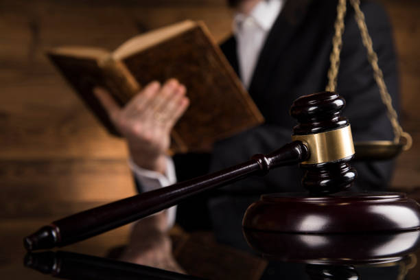 istock Paragraph, Judge hold hammer on wooden table 1194849795