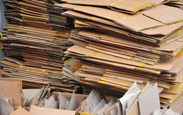 istock Flattened cardboard boxes being recycled 1194849796