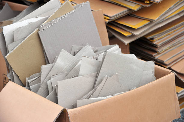 Flattened cardboard boxes being recycled stock photo