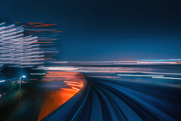 istock Futuristic High Speed Light Tail with Night City Background 1194849878