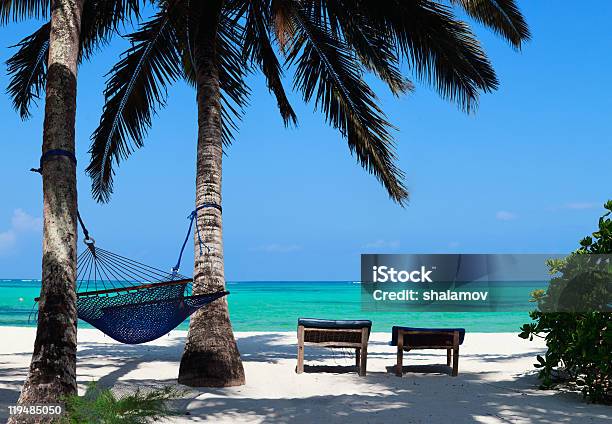 Hammock And Sun Beds On A Perfect Tropical Beach Stock Photo - Download Image Now - Beach, Beauty In Nature, Blue