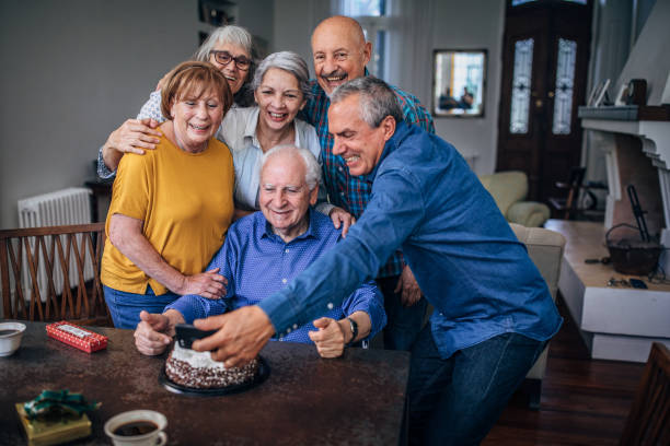 istock Senior people taking a selfie on birthday party 1194851754