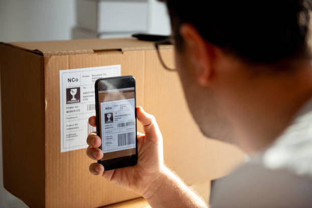 istock Delivery service, scanning a shipping label 1194856237