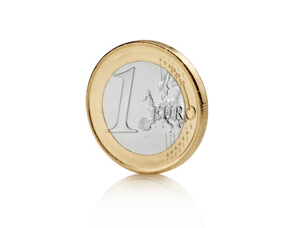 Euro coin isolated Close up view of euro coin against Bright white background with soft reflection european union coin photos stock pictures, royalty-free photos & images