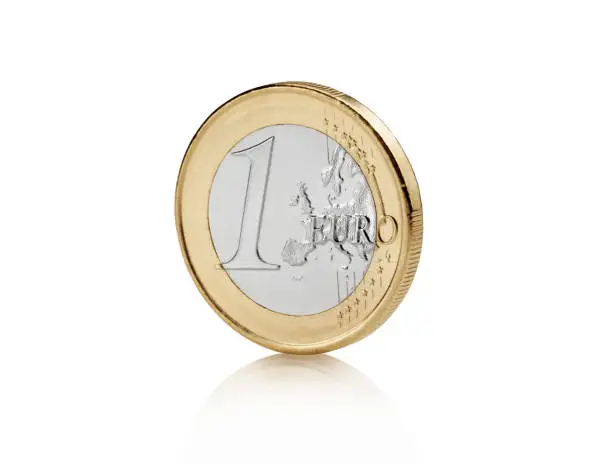 Close up view of euro coin against Bright white background with soft reflection