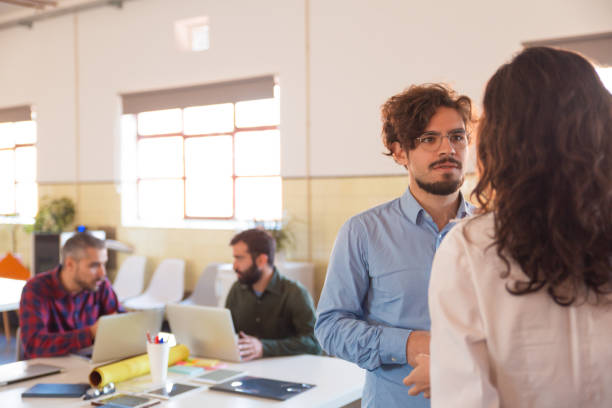 istock Serious partners talking in meeting room 1194859747