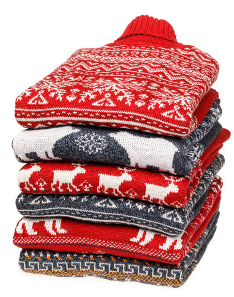 istock Stack of folded knitted Christmas turtleneck sweaters on white background 1194861755