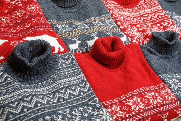 istock Collection of knitted Christmas turtleneck sweaters laid folded 1194861757