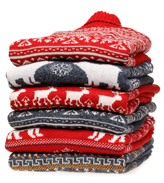 istock Stack of folded knitted Christmas turtleneck sweaters on white background 1194861901