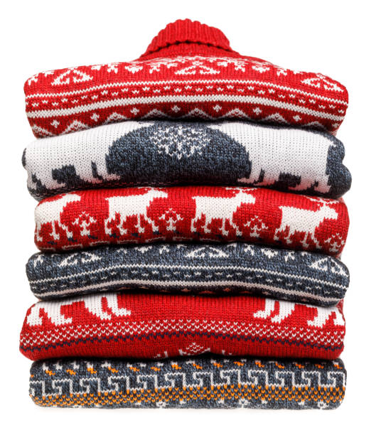istock Stack of folded knitted Christmas turtleneck sweaters on white background 1194862029