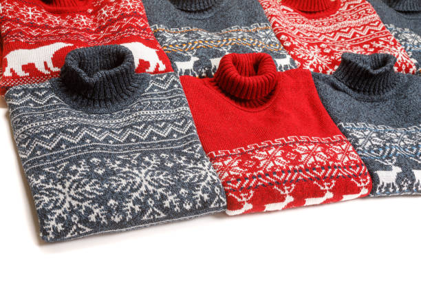 istock Collection of knitted Christmas turtleneck sweaters folded on white background 1194862080