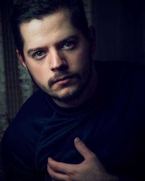 istock male model dressed in a black blouse 1194864402