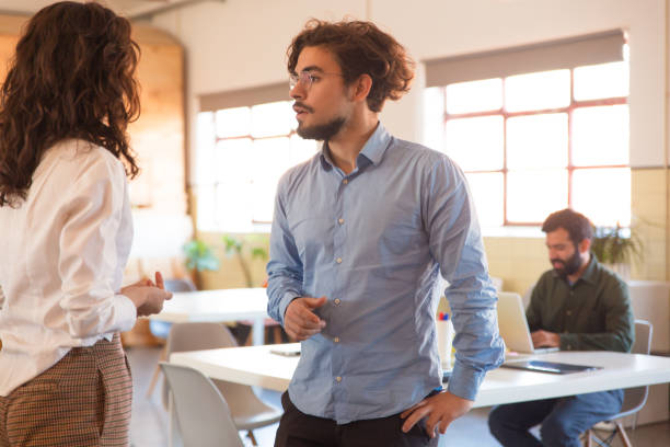 istock Couple of coworkers arguing about project 1194865038