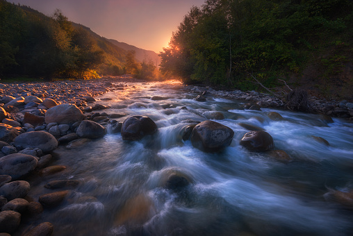 Caucasus. beautiful sunrise over fast flowing mountain river