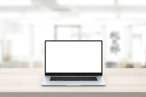 Laptop mockup on office desk. Isolated screen for mockup, app or web site presentation