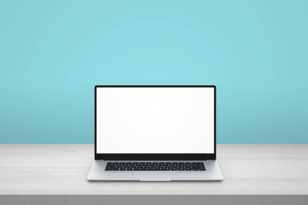 istock Laptop on desk. Isolated scree for mockup. Blue background 1194867141