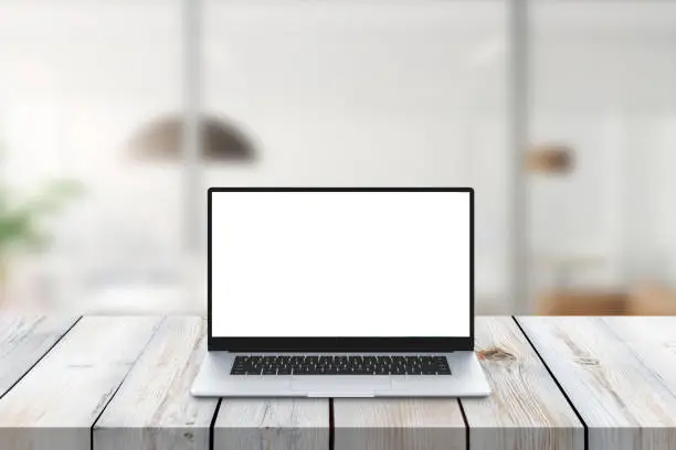 Modern laptop on office desk mockup. Isolated screen for app or website promotion