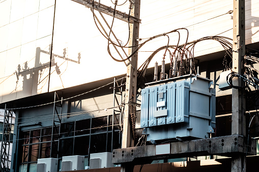 High voltage AC power transformer, connected with wires and cables, maintaining a stable voltage inside the city and metro area