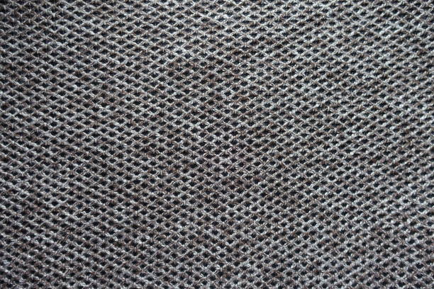 Gray knitted pattern, close-up, full frame fabric background