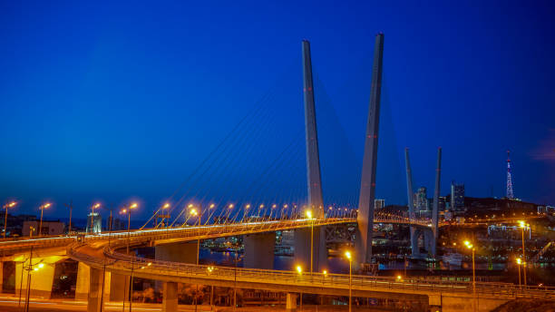 istock Golden bridge against the blue evening sky. 1194871487