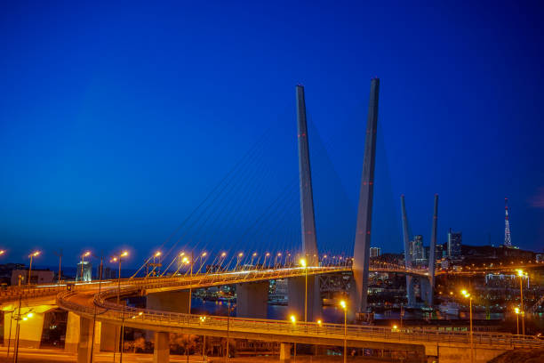istock Golden bridge against the blue evening sky. 1194871496