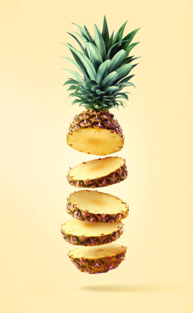 istock Flying fresh ripe pineapple cut into slices 1194873077