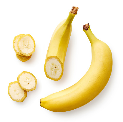 Fresh whole, half and sliced banana isolated on white background, top view