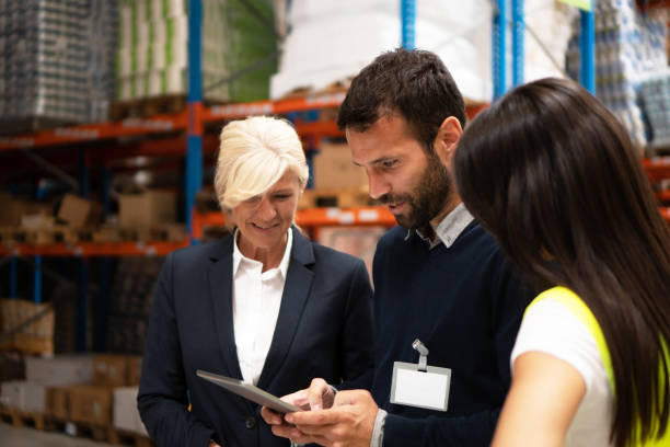 istock Managers checking the list of products 1194873085