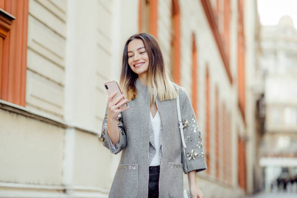 Pretty young woman using a phone