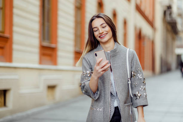 istock Pretty young woman using a phone 1194873468