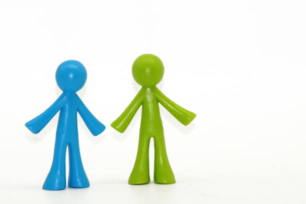 istock Figures as a symbol of same-sex relationship on a white background 1194875003