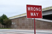 Wrong Way sign by a highway.