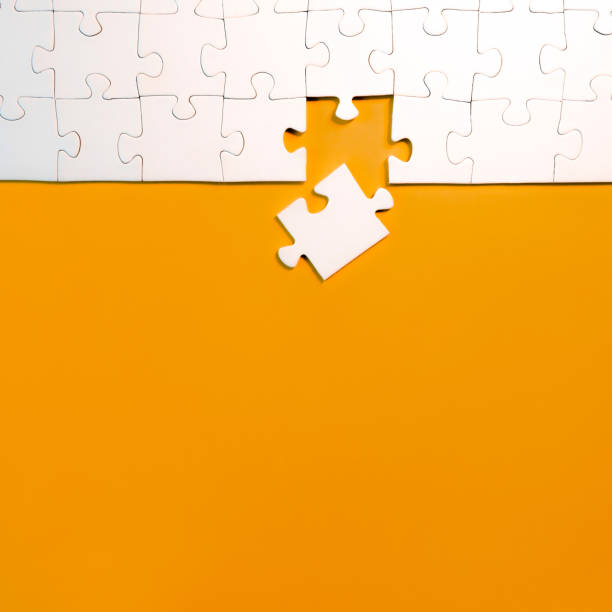 istock top view of jigsaw puzzle with one piece left 1194876341