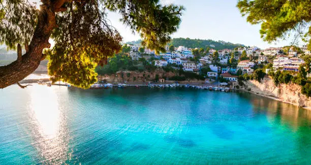 Photo of Beautiful Alonissos island - picturesque fishing village Votsi. Sporades, Greece