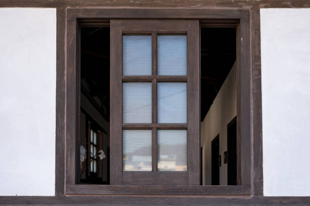 istock Brown wooden window opened on wall 1194879623