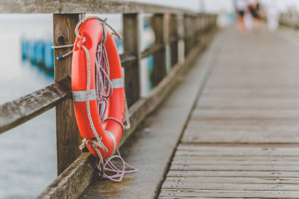 anello di salvataggio - life jacket isolated red safety foto e immagini stock