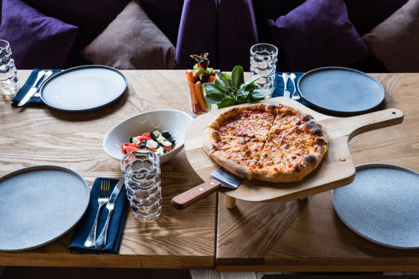 istock margarita pizza on the servered table in restaurant 1194881709