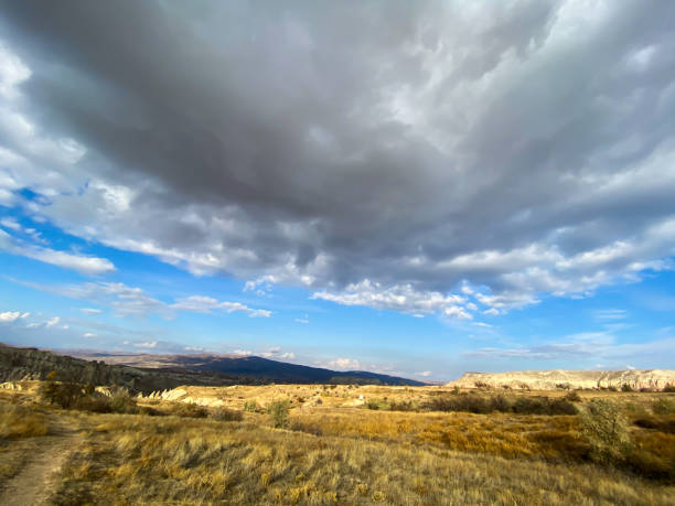 istock View of a valley filled with ancient rock formations. Blue sky, white clouds. Cappadocia, Turkey. 5 november 2019 1194886534