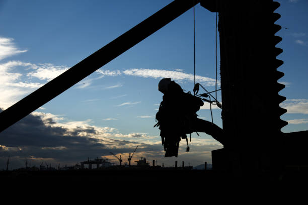 istock Wide Shot of the Rappel Down the Steel Tower with the Threads 1194888198