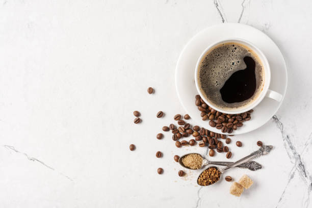 istock Top view of black coffee in white cup with sugar for breakfast 1194890247