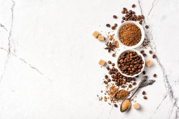 istock Roasted beans with ground coffee in white bowl and cane sugar 1194890284