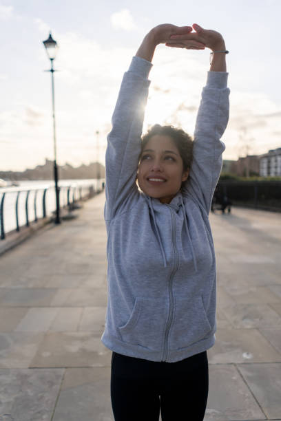 istock Woman stretching before working out in the morning 1194895584