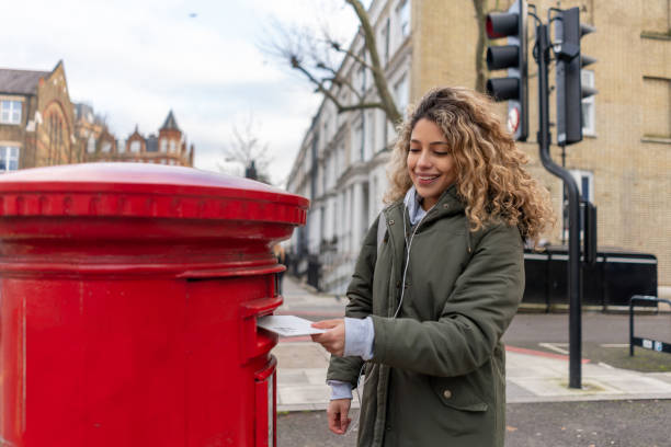 istock Woman sending a letter by mail 1194895600
