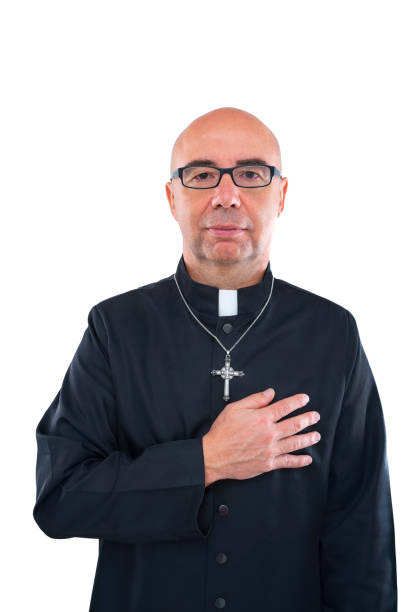 istock Priest blad hand in heart portrait with collar 1194897214