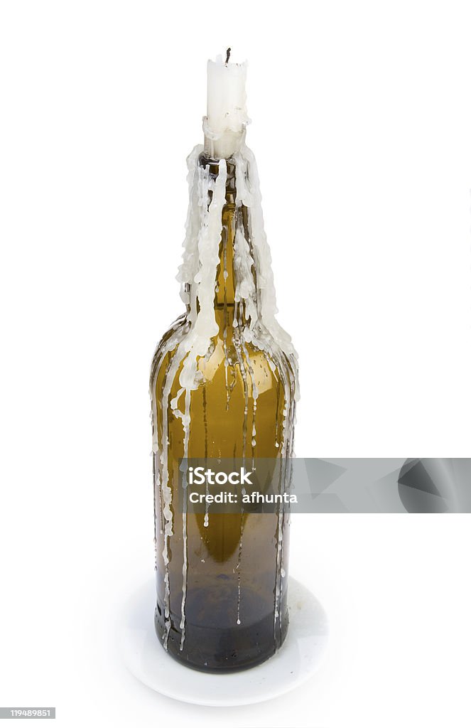 the  candle stuck in a bottle  Beeswax Stock Photo
