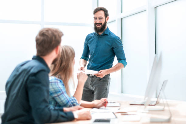 istock project Manager discussing with business team business documents 1194902912
